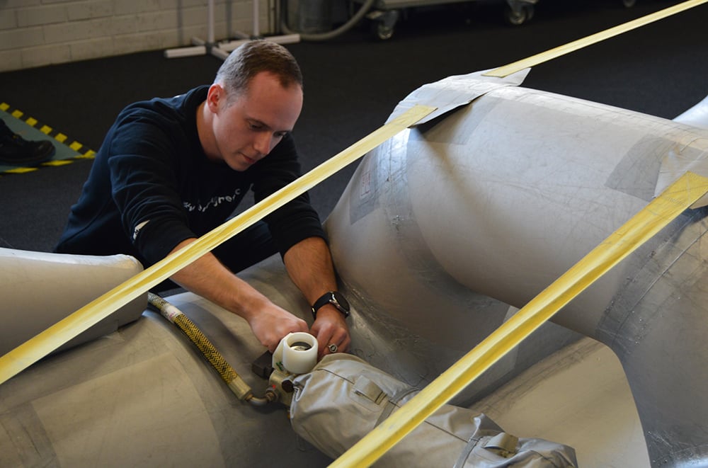 Technician inspects escape slide