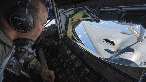 KC-135 airman in cockpit refueling B-2